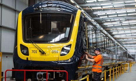 Mick Waldram works on a train at Alstom’s plant in Derby.