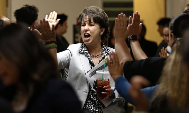 Senator Connie Leyva high-fives supporters in the hallway of the capitol building in Sacramento, California, in 2019.