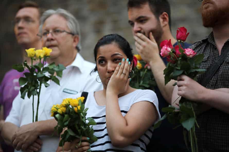 A woman looks tearful as she attends a vigil outside Finsbury Park Mosque.