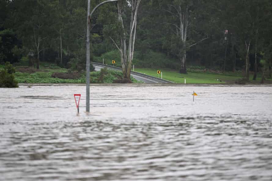 A road is cut by flood water in Ipswich on Friday.