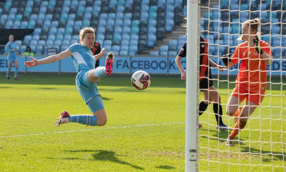 Manchester City’s captain Ellen White (left) scores their fourth goal of the game.