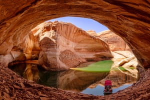 Shortlisted - Cathedral in the Desert 2021 Lake Powell, Utah, USA Originally named for its natural resemblance to a cathedral, the monument has been buried nearly 100 feet under the flood-waters of the Lake Powell reservoir since 1963. Droughts reduced the water level in 2021 enabling this image of Reflection Canyon