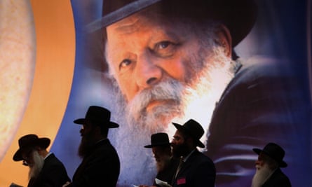 A group of men pray during a ceremony honoring Rabbi Menachem Mendel Schneersonin Tel Aviv, Israel on 21 June 2004.