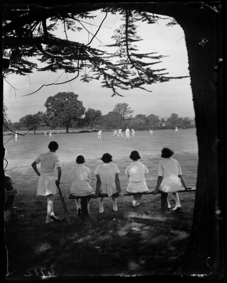 Cricket players rest while watching a match at the Women’s Cricket Week at Colwall in 1935.