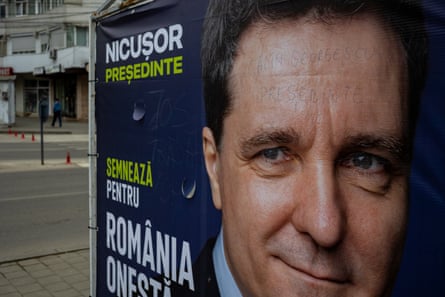 Călin Georgescu, president, has been scribbled across his forehead