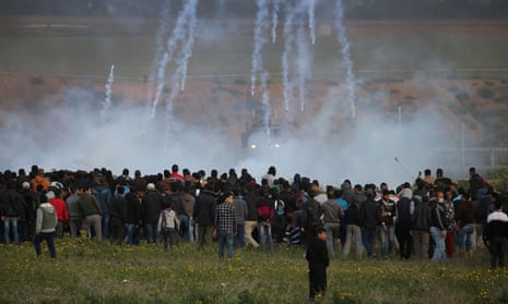 Israeli troops fire teargas at Palestinians protesting near the Gaza border fence