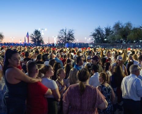 People arrive to attend the public memorial service of rightwing activist Charlie Kirk outside State Farm stadium in Glendale, Arizona.