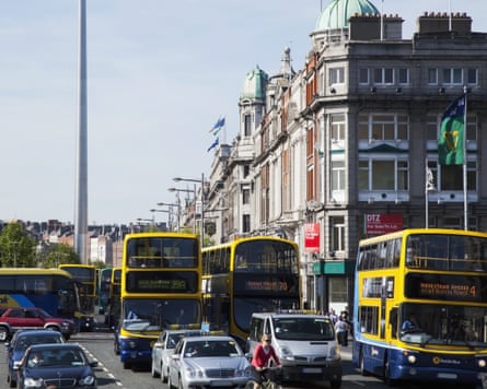 Buses on a crowded Dublin street.