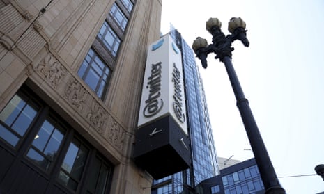 twitter sign on side of building