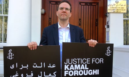 Kamran Foroughi, son of detainee Kamal Foroughi, protests outside the Iranian embassy in London.
