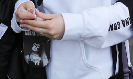An Ariana Grande fan holds her VIP backstage pass for Monday night’s Manchester concert.