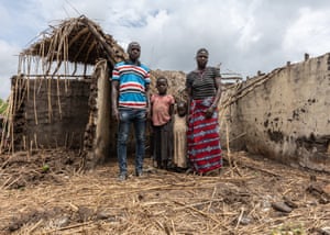 Moise, his wife and two children on their farm
