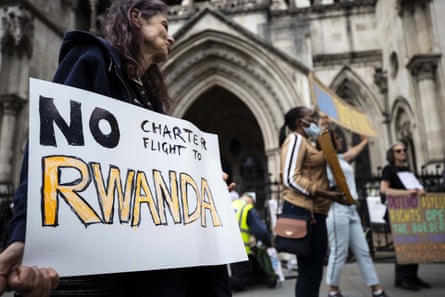 ‘No charter flight to Rwanda’ with other protesters in background