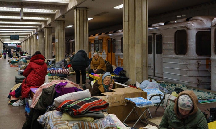 Kharkiv residents rest as they shelter from attacks in a metro station in Kharkiv.