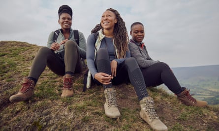 Rhiane Fatinikun, with two other women, all in walking boots on top of a hill