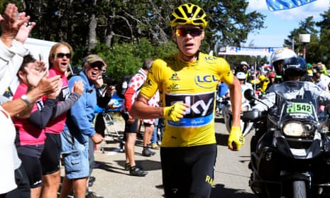 Christopher Froome of Team Sky runs without his bicycle after crashing.