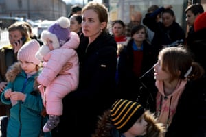 A family prepares to evacuate by train to Lviv, Ukraine