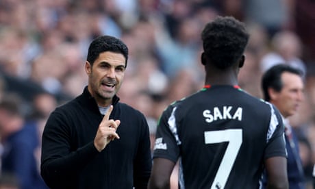 Mikel Arteta gives instructions to Bukayo Saka during the 2-0 victory at Aston Villa.
