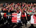 Arsenal fans singing at Meadow Park with Ellesse Johnson and Farah Chowdhury holding banner