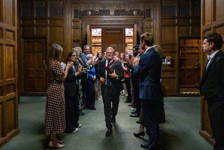 Keir Starmer walks a gauntlet of colleagues applauding him as he exits his final PMQs.