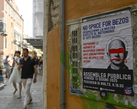 A ‘No space for Bezos’ is pasted on a wall in Venice