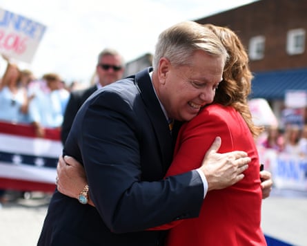 Man hugs woman