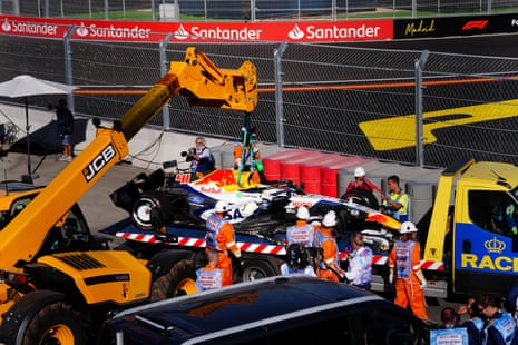 The Racing Bulls of Arvid Lindblad is lifted up by a crane at the Madring