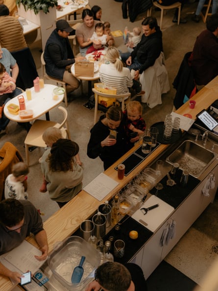 Aerial view of people lounging and chatting in brewery