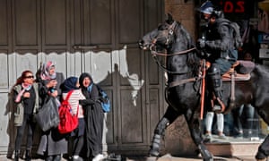 An Israeli mounted policeman dispersing Palestinian protesters in east Jerusalem.