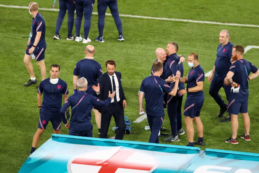 Gareth Southgate celebrates with back room staff at the final whistle