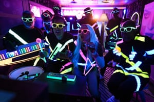 Host Jimmy Fallon, singer Madonna, and The Roots all go UV during Classroom Instruments on the Tonight Show, New York, US