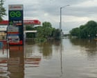 ‘A saltwater crocodile on the AFL oval’: worst flooding in decades inundates NT as residents urged to avoid water