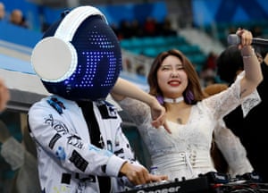 A DJ plays at the mens ice hockey play-off Match between Slovenia v Norway.