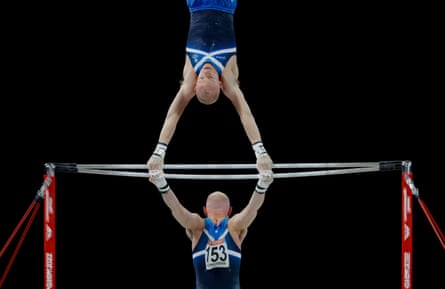 A multiple exposure showing Hamish Carter of Scotland on the high bar during the men’s team gymnastics competition.