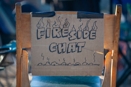 A sign that says ‘fireside chat’ on the back of a chair
