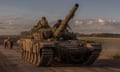 Ukrainian servicemen operate a Soviet-made T-72 tank in the Sumy region, near the border with Russia, on 12 August amid the Russian invasion of Ukraine. 