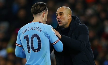 Pep Guardiola talking to Jack Grealish