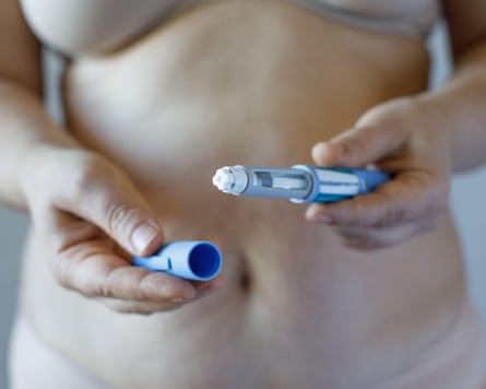 Woman opening Semaglutide Injection pen