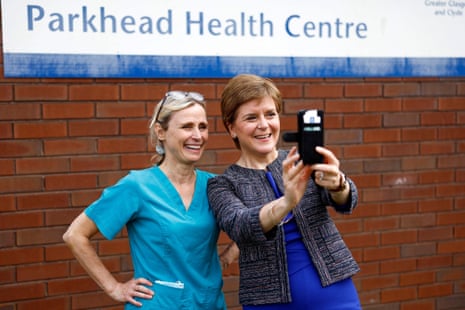 Nicola Sturgeon posing for a selfie with a member of staff on a visit to the Forge Medical Centre in Parkhead, Glasgow, today.