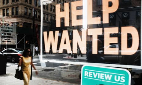 shopfront with 'help wanted' sign