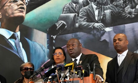 Attorney Ben Crump, joined by the daughters of Malcolm X, Ilyasah Shabazzv and Malaak Shabazz, speaks at the Malcolm X and Dr Betty Shabazz memorial center in New York on 21 February.