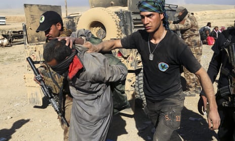 Iraqi special forces arrest an Isis suspect as they continued their advance through Mosul. Attention is now turning to the future of northern Iraq, with the Kurds pushing for self-rule following the loss of some 1,700 peshmerga in battle.  