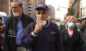 Rudy Giuliani and Hillary Clinton tour the site of the World Trade Center disaster on 12 September 2001.