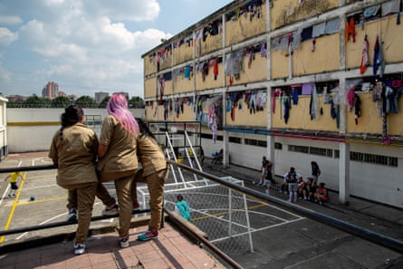 Inmates watch a football game from a raised viewpoint at El Buen Pastor women’s prison.