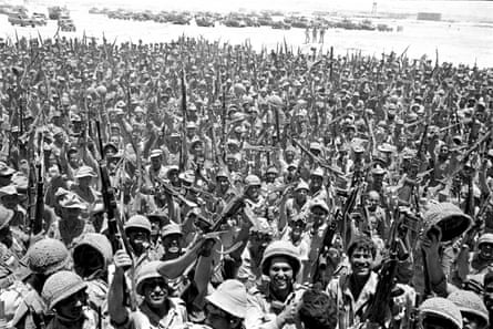 large crowd in uniform cheering