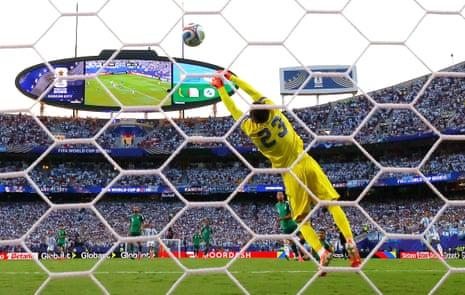 Lionel Messi scores their first goal past Algeria's Luca Zidane