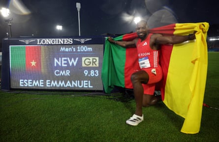 Emmanuel Eseme celebrates after winning the men's Commonwealth Games 100m final.
