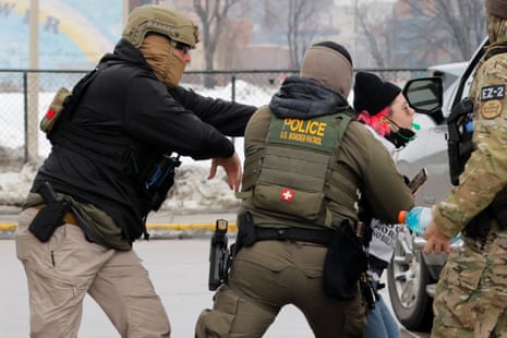 U.S. Border Patrol Agents push back a protestor at a gas station a day after the fatal shooting of Renee Nicole Good by a U.S. Immigration and Customs Enforcement (ICE) agent, in Minneapolis, Minnesota, U.S., January 8, 2026. REUTERS/Brian Snyder