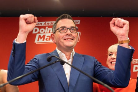 Andrews holding his fists in the air after winning the 2022 election.