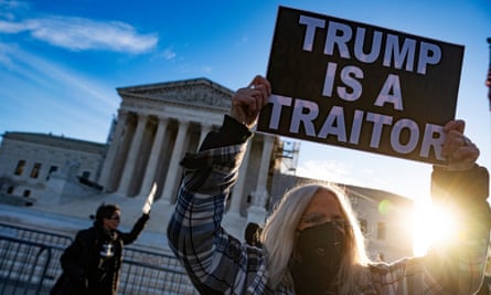 Anti-Trump demonstrators protest outside the US supreme court in February